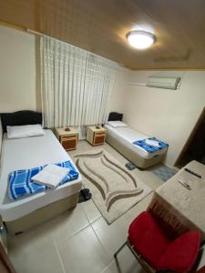 Postel nebo postele na pokoji v ubytování Elmas Pansiyon