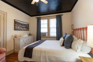a bedroom with a bed and a window at Historic Revival Midtown Memphis Duplex 64 Yes Pets Fast Wifi Free Parking in Memphis
