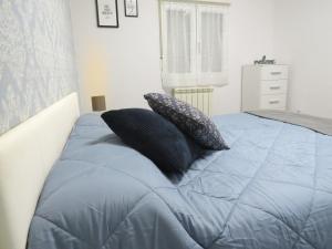 A bed or beds in a room at Gran piso pleno centro. Plaza del Pilar + Desayuno
