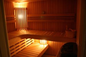 a sauna with a light on the inside of it at Les Authentics-Le Retour aux Sources in La Bresse