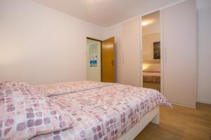 Posteľ alebo postele v izbe v ubytovaní Apartment Ivan 2