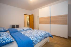 Posteľ alebo postele v izbe v ubytovaní Apartment Ivan 2