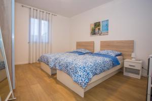 Posteľ alebo postele v izbe v ubytovaní Apartment Ivan 2