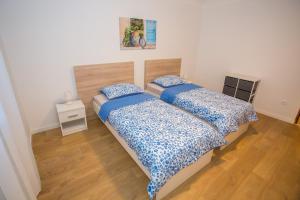 Posteľ alebo postele v izbe v ubytovaní Apartment Ivan 2