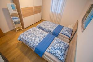 Posteľ alebo postele v izbe v ubytovaní Apartment Ivan 2