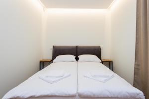 Postel nebo postele na pokoji v ubytování Palanga Apart 5 + 5 fotografií