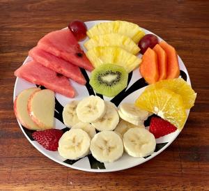 a plate of fruit on a wooden table at Dreams Lodge in Monteverde Costa Rica