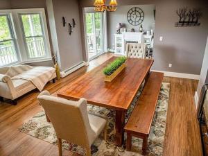 a living room with a wooden table and chairs at Ride from this Mini Mansion to all the ATV Trails in Berlin