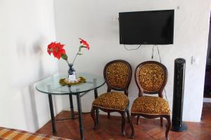 TV a/nebo společenská místnost v ubytování Casa Turistica Barichara + 37 fotografií