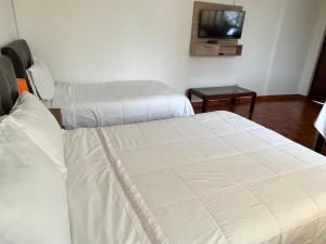 Postel nebo postele na pokoji v ubytování Casablanca Lima