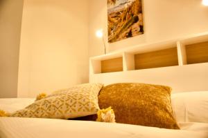 a bedroom with a bed with a pillow on it at Haus Allegra Panorama in Saas-Fee