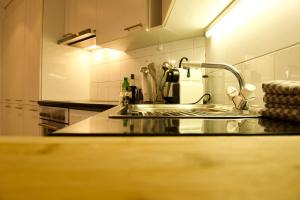 a kitchen with a sink and a counter top at Haus Allegra Panorama in Saas-Fee