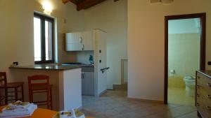 a kitchen with a sink and a counter top at Porta Nuova Room Locazione Breve Turistica in Benevento +30 photos