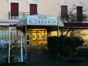 a sign for a store in front of a building at Hotel Master in Albignasego