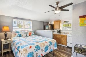 a bedroom with a bed and a kitchen at C4-Octopus in St. Pete Beach