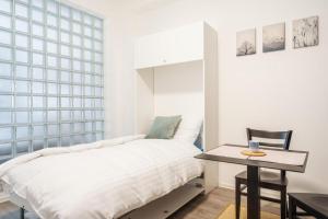 Postel nebo postele na pokoji v ubytování Self check-in apartments by Amber