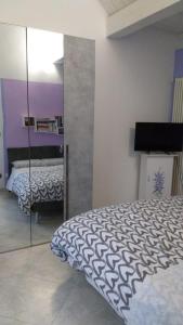 Katil atau katil-katil dalam bilik di B&B Il Glicine Nascosto