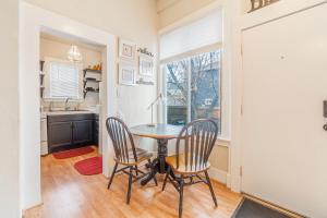 a dining room with a table and two chairs at Rustic Studio walking distance to Downtown in Reno