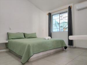Ένα ή περισσότερα κρεβάτια σε δωμάτιο στο Casa Zihuana +31 φωτογραφίες