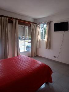 TV a/nebo společenská místnost v ubytování Departamentos Santiago + 22 fotografií