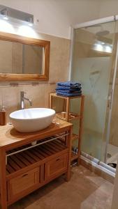 a bathroom with a sink and a shower at Location Rez de maison dans quartier charmant in Saint-Raphaël +15 photos