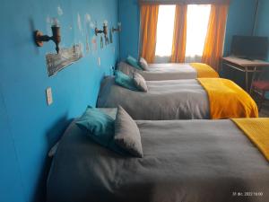 Ένα ή περισσότερα κρεβάτια σε δωμάτιο στο Hostal Klein
