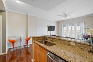 a kitchen with a sink and a counter top at Cozy Condo @ Charlotte NC! w/Pool- Walk to Uptown in Charlotte