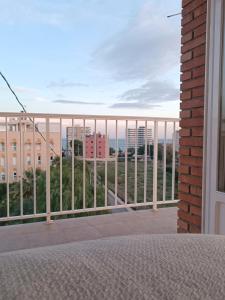 a balcony with a view of a city at California Suite - All-day Sunny 2-Bedroom Apartment in El Campello