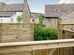 a wooden fence in front of a house at Holmfield in Buxton