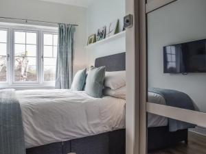 Posteľ alebo postele v izbe v ubytovaní Hawthorn Cottage