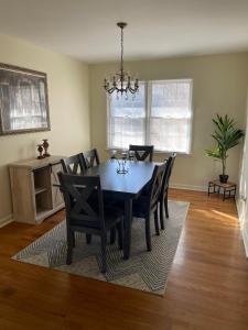 a dining room with a black table and chairs at You won't want to leave! in Huntsville