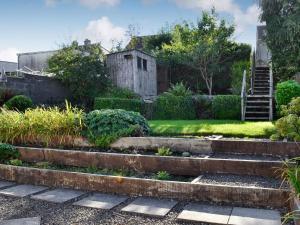 a garden with stairs and an old shed at Cottonmill Cottage in Minnigaff