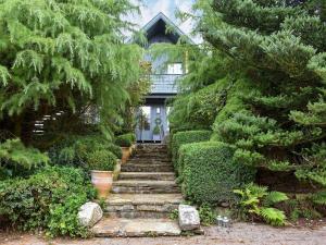 a garden with stairs leading to a house at Hadrians Garden Cottage - Uk3323 in Bardon Mill