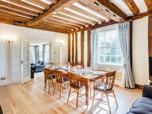 a dining room with a table and chairs at Pattiswick Hall in Stisted