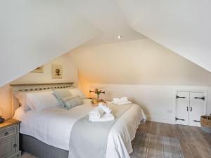 a bedroom with two beds in a attic at The Liddel Haven - Uk35337 in Saughtree
