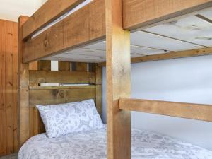 a bedroom with two bunk beds with a pillow at Dark Lane in Chesterfield
