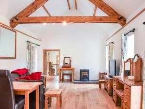 a living room with a couch and a table at Slade Cottage - Uk35027 in Highbray