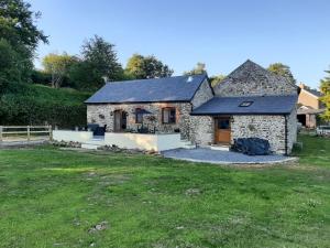 a stone house with a yard in front of it at Slade Cottage - Uk35027 in Highbray