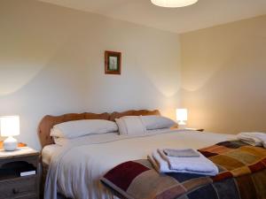 Ένα ή περισσότερα κρεβάτια σε δωμάτιο στο Owls Retreat