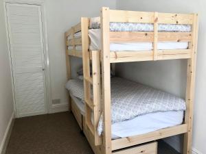 a couple of bunk beds in a room at Summerland Terrace in Kingswear
