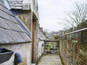an alley in an old stone building with a roof at Braidwood Castle - Uk10672 in Braidwood