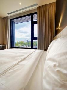 Postel nebo postele na pokoji v ubytování alfar Hotel