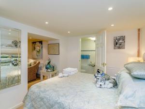 a bedroom with a bed with stuffed animals on it at The Gatehouse-uk11836 in Dronfield