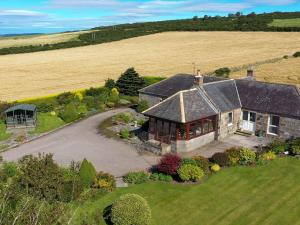 an aerial view of a house in a field at Sauchenshaw Cottage in Maryculter