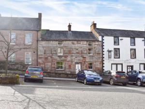 a group of cars parked in front of a building at The Black Bull in Appleby