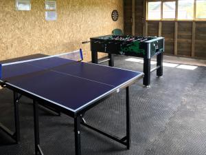 two ping pong tables in a ping pong room at Scrumpy Barn - Uk12014 in Luton