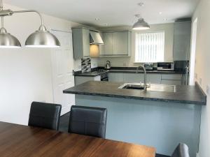 a kitchen with a sink and a counter top at Forest Walk in Coleford