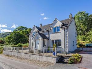 a house on the side of a road at Lochside House - S4532 in Letterfearn