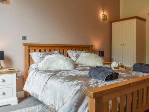 a bedroom with a bed with pillows on it at Church View Apartment in Scarborough