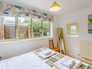 a bedroom with a bed and a window at Top Studio-uk35143 in Lincoln